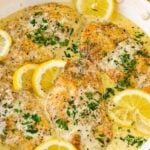 one pan creamy lemon chicken with lemon slices as garnish