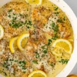 creamy lemon chicken skillet with fresh lemon garnish