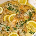 creamy lemon chicken in one skillet with fresh lemons