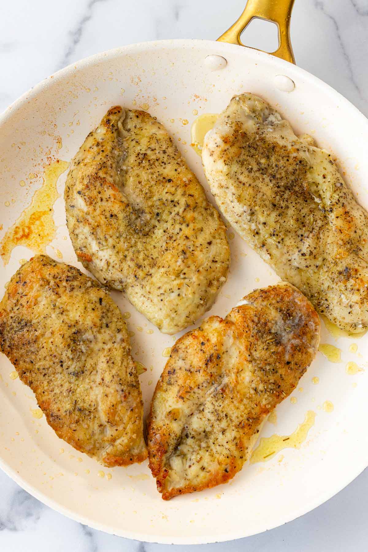 seared chicken breasts in skillet