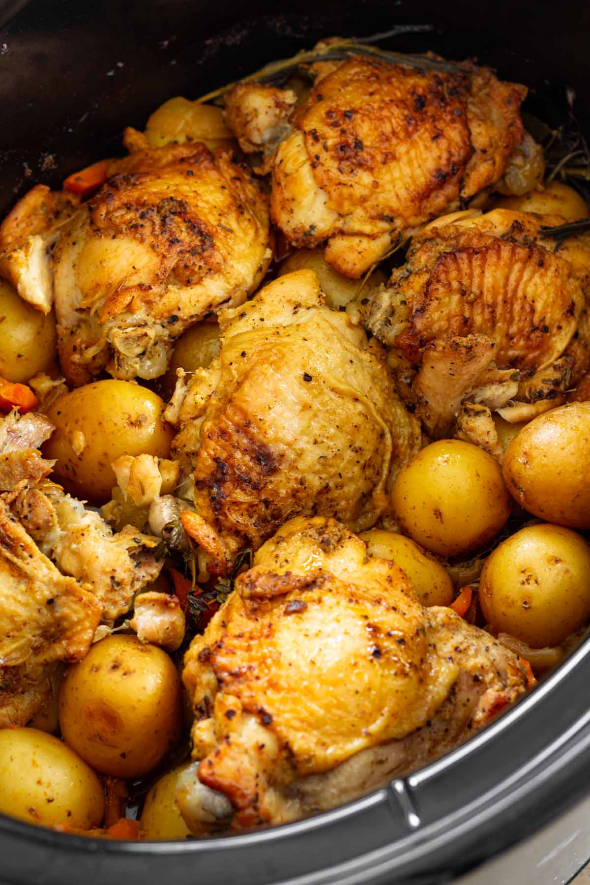 slow cooked chicken thighs with potatoes and carrots