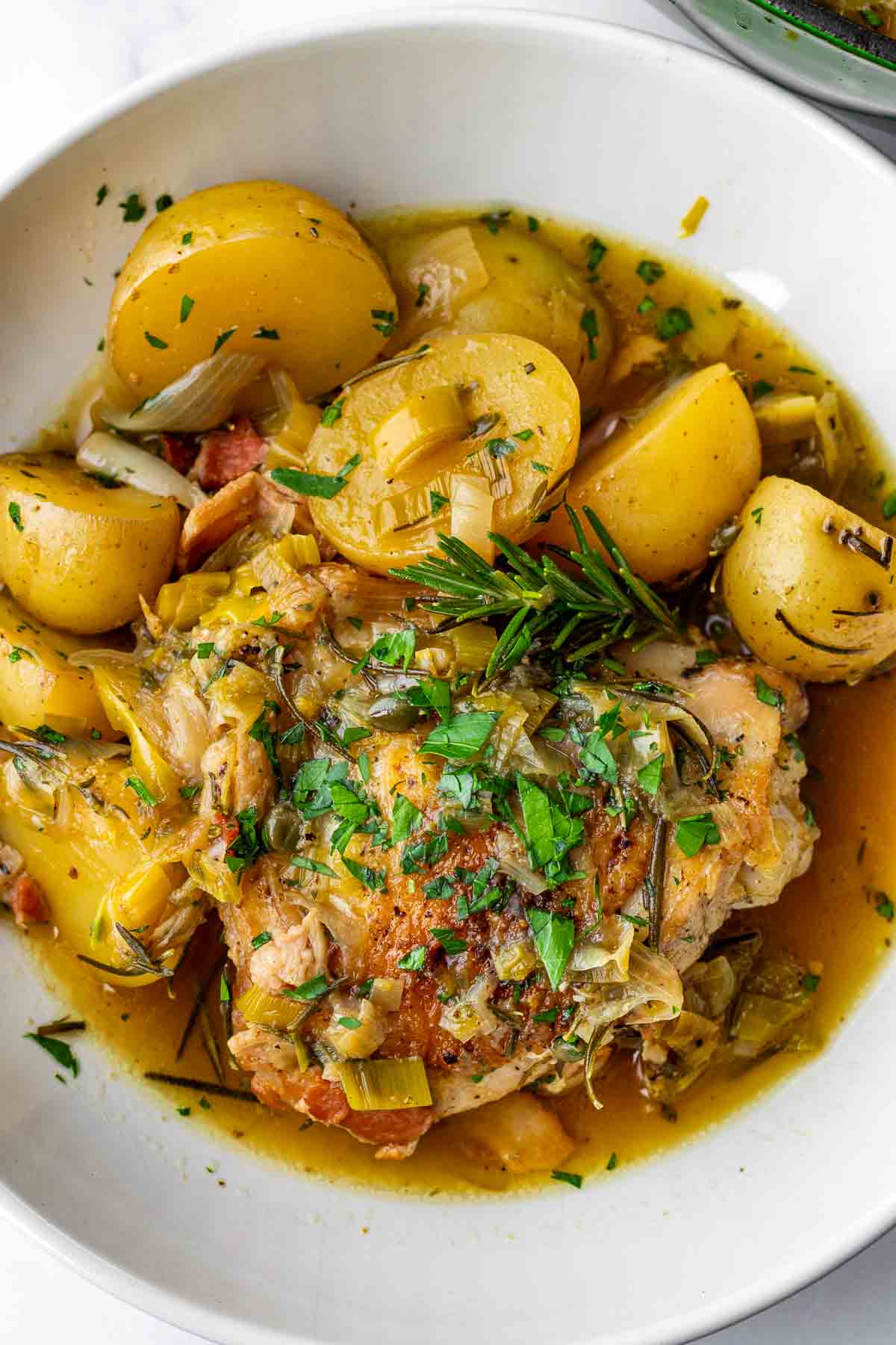a serving of braised thighs and potatoes in a bowl