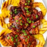 huli huli chicken grilled with pineapple rings on the bottom