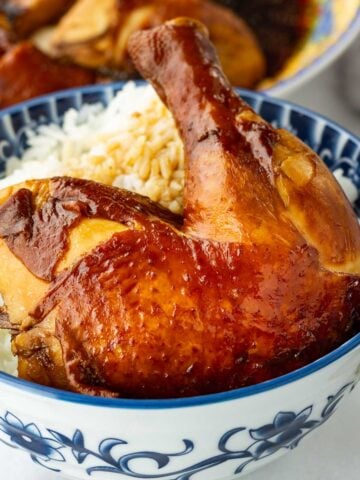 soy sauce chicken leg on rice in a bowl