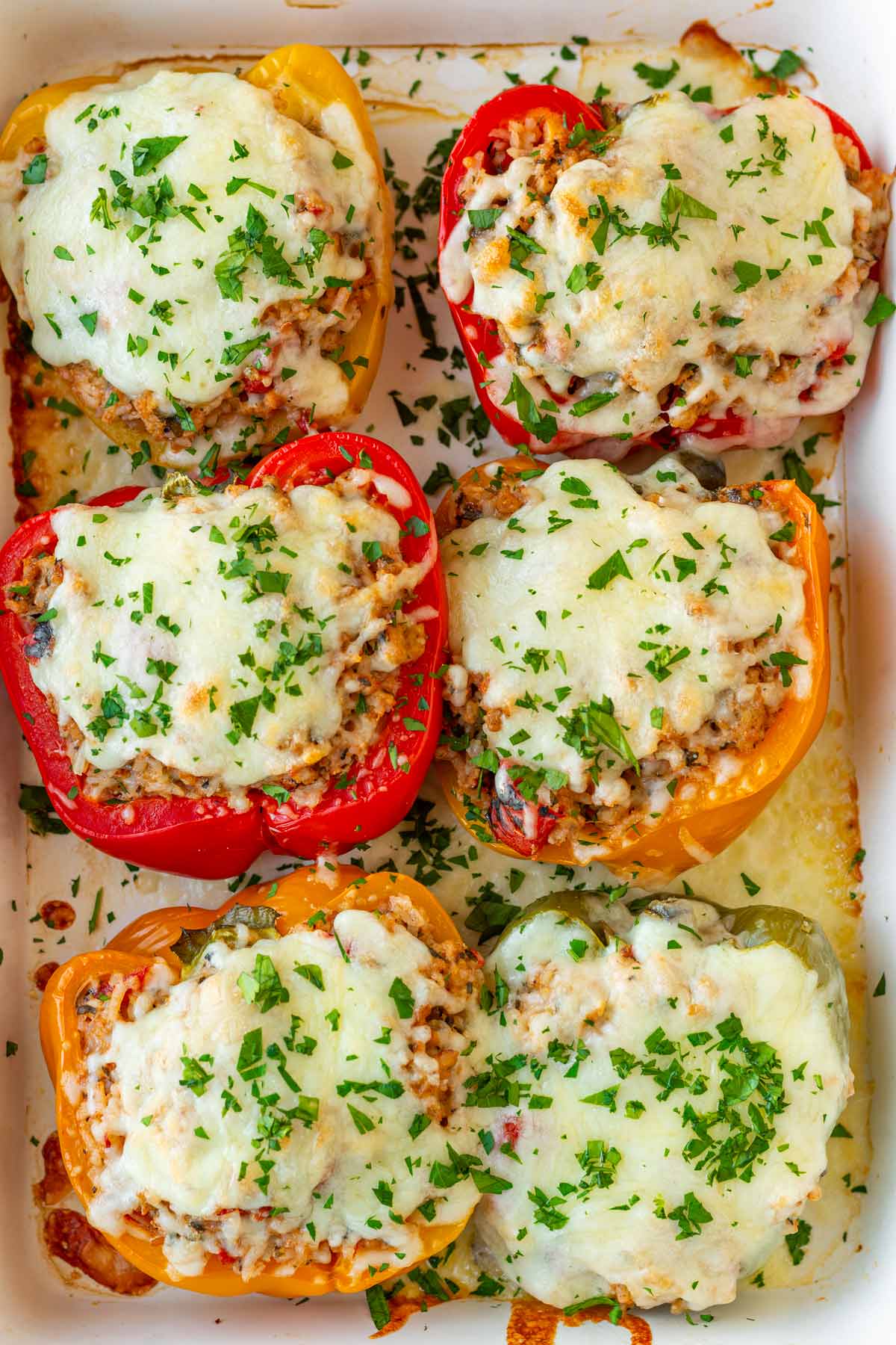 baked turkey stuffed peppers with rice and mozzarella cheese melted on top
