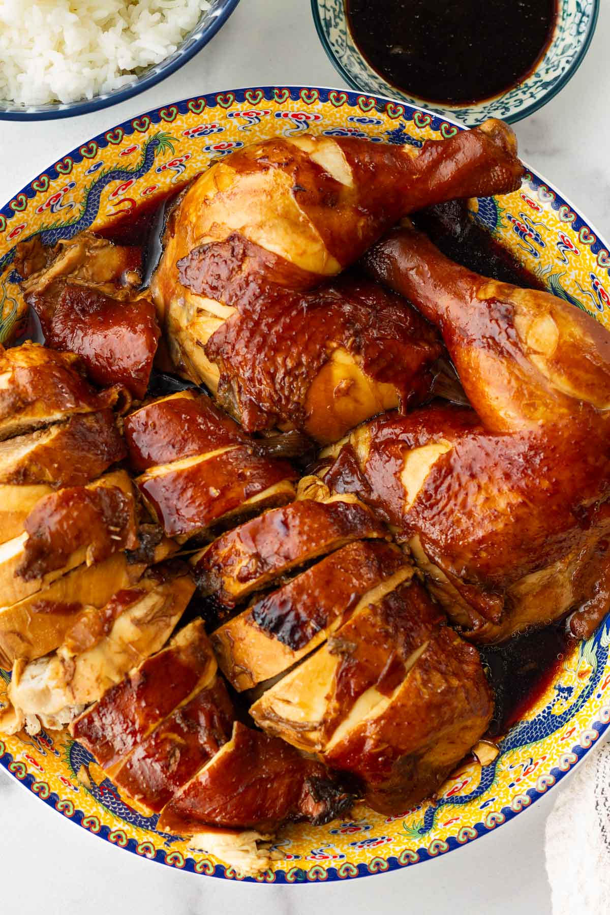 sliced chinese soy sauce chicken with sauce