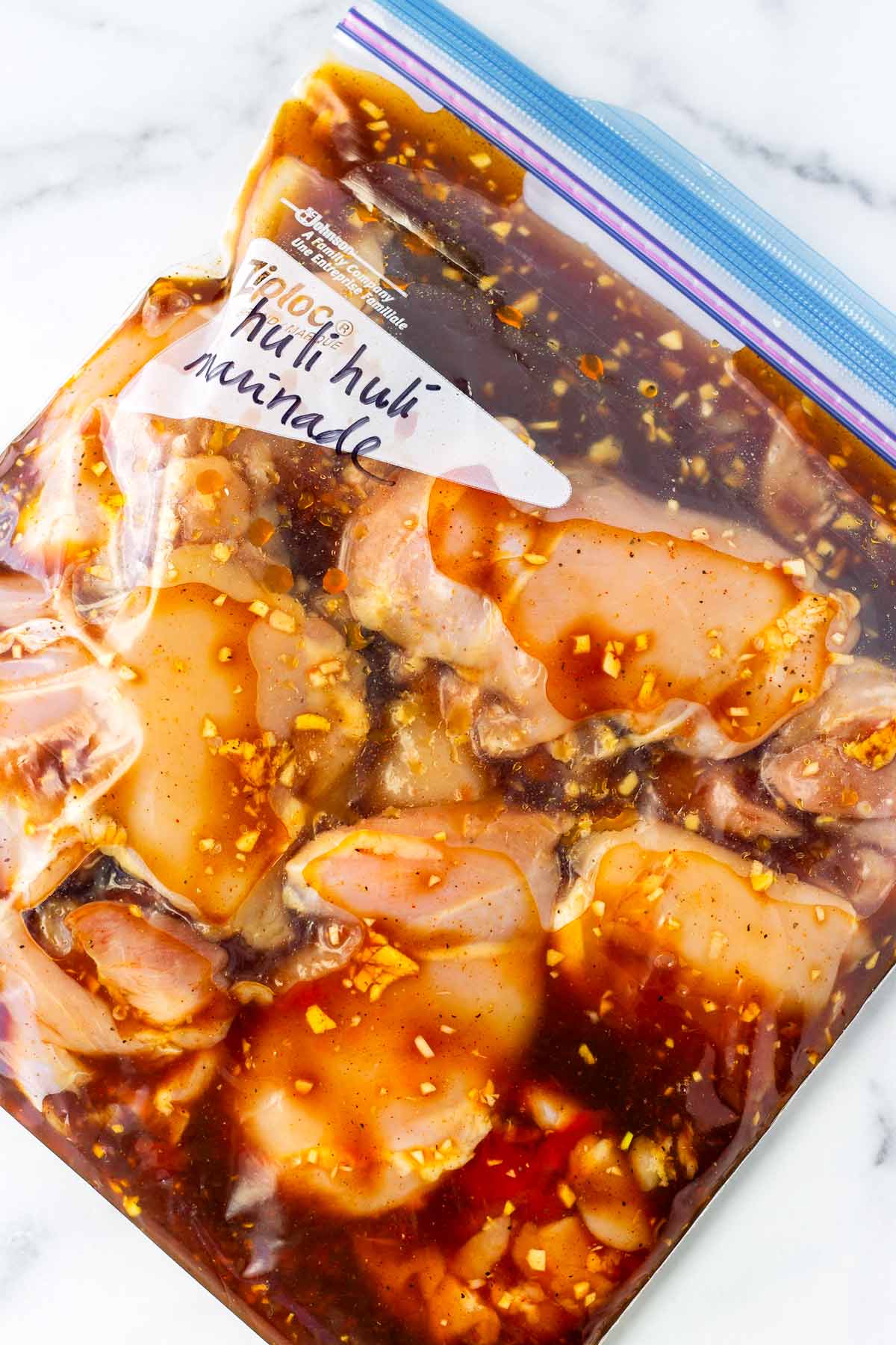 marinating chicken in a resealable bag with the huli huli marinade