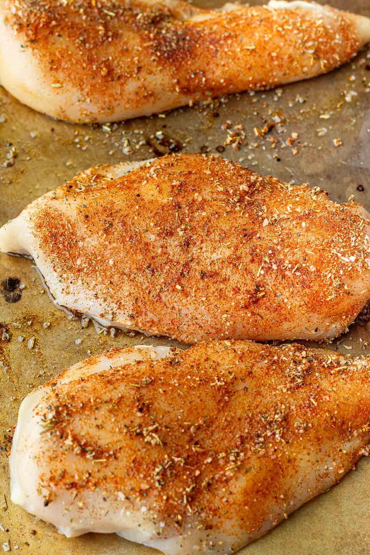 seasoned chicken breasts on sheet pan