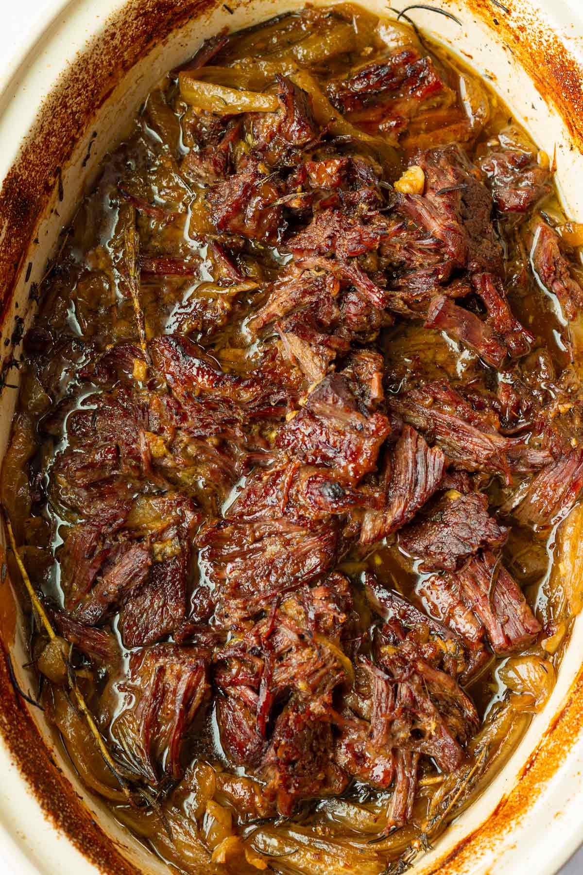 caramelized shredded chuck roast in pan