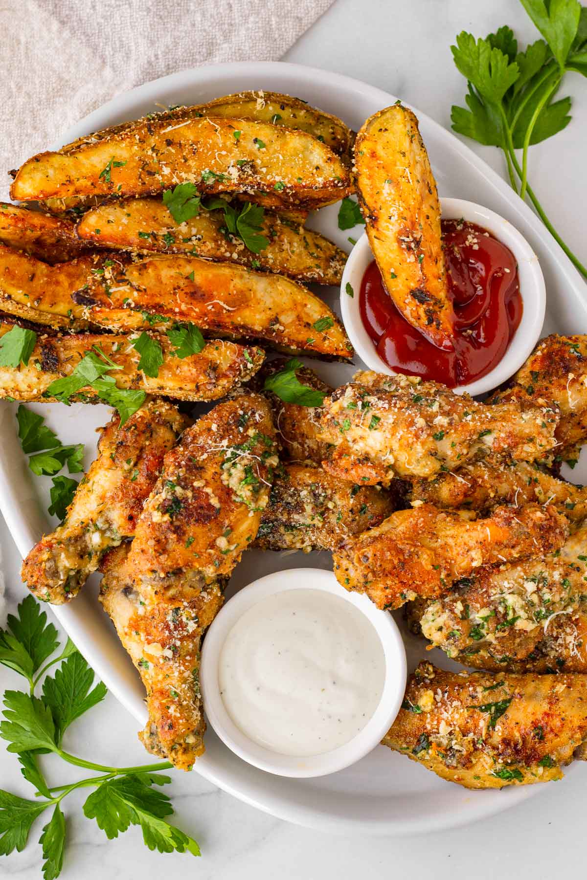 side of baked potato wedges with garlic parmesan chicken wings