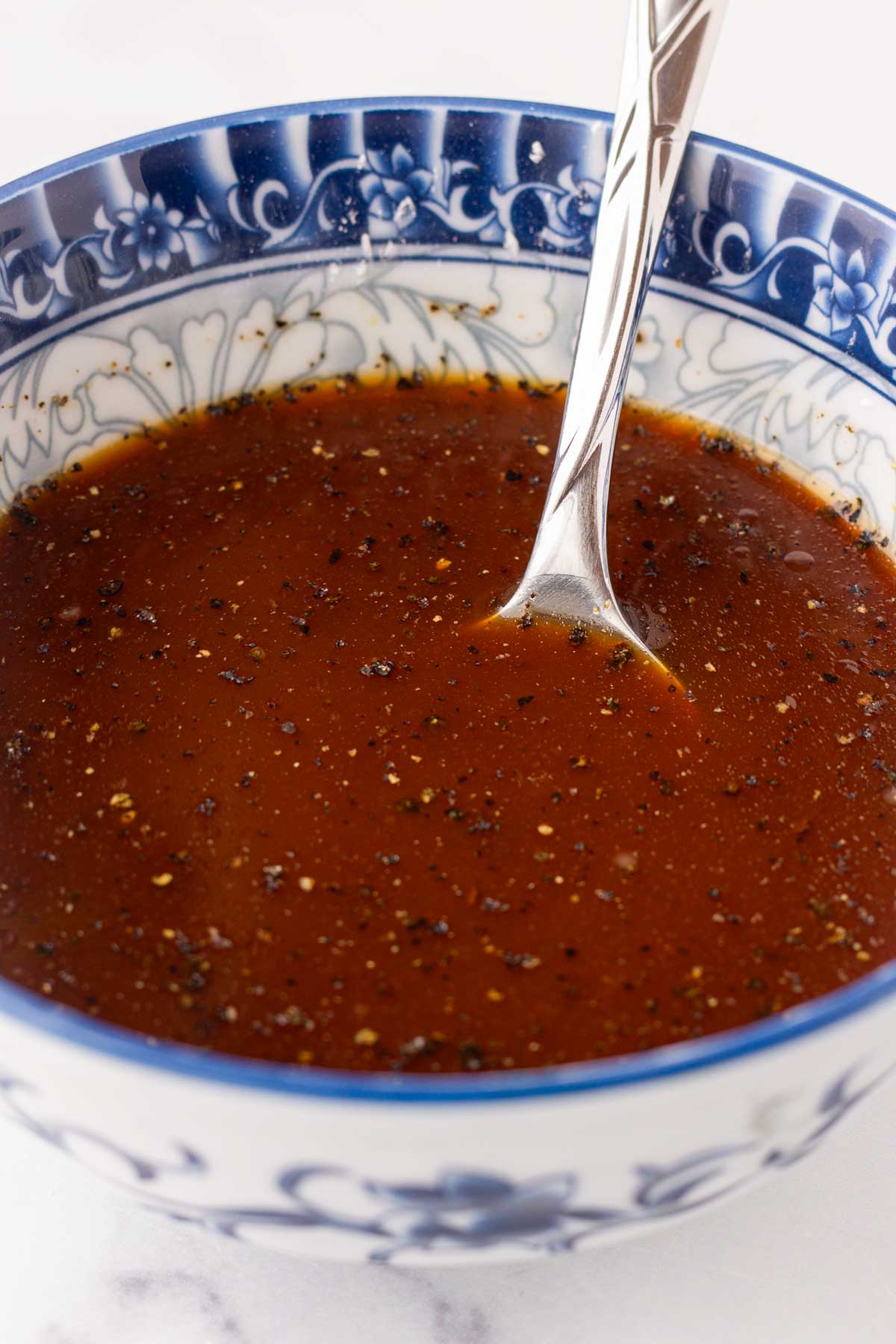 mixing the black pepper stir fry sauce in a bowl