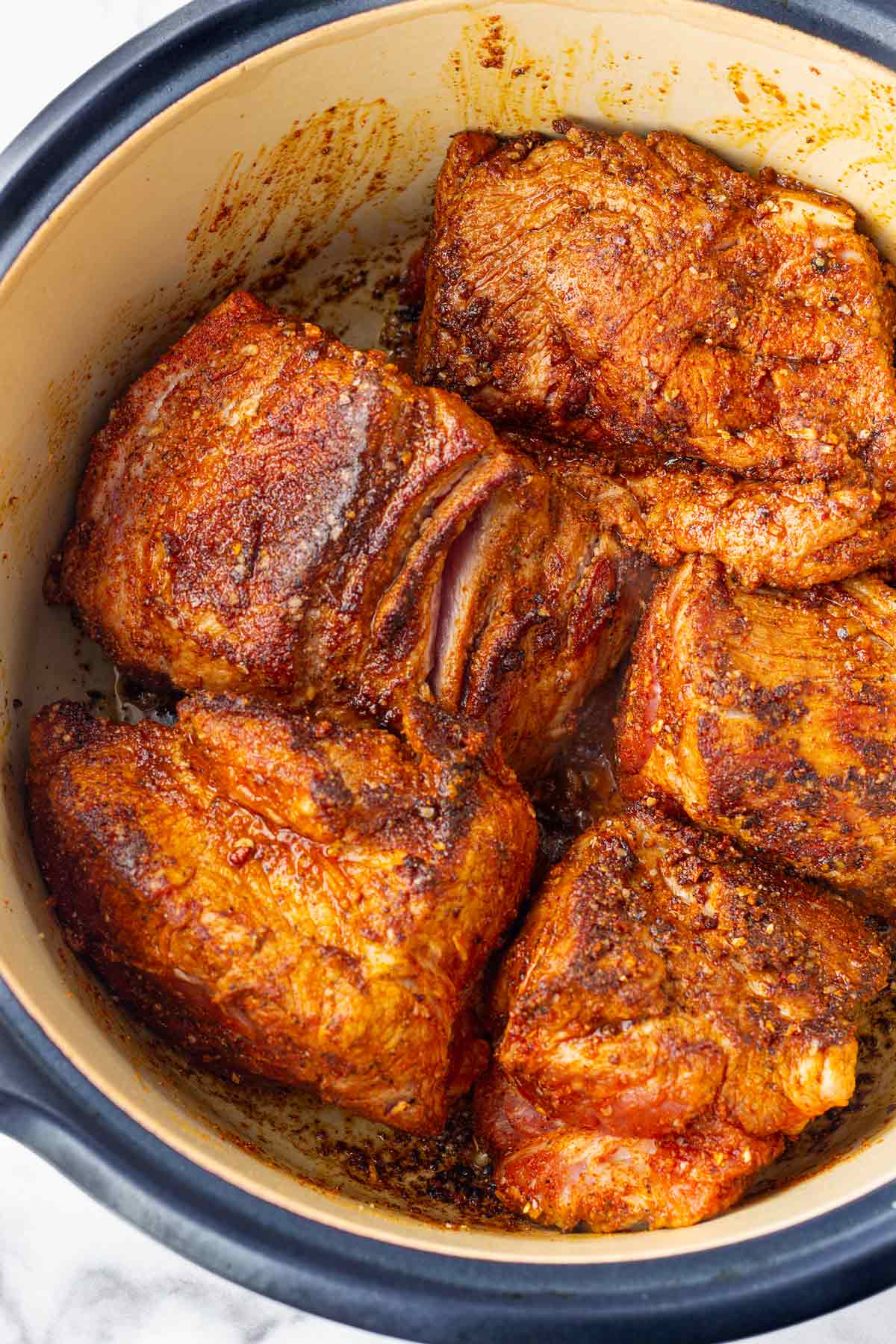 seared pork pieces in dutch oven