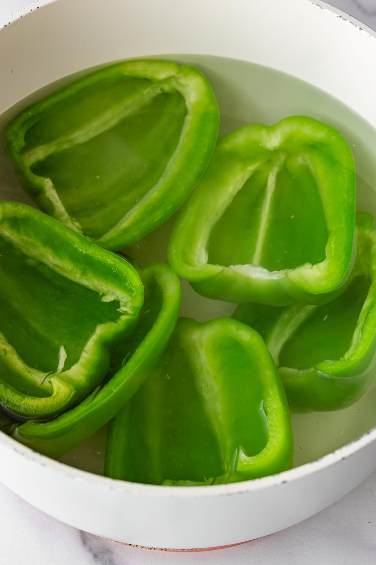 parboiling green bell peppers in boiling water