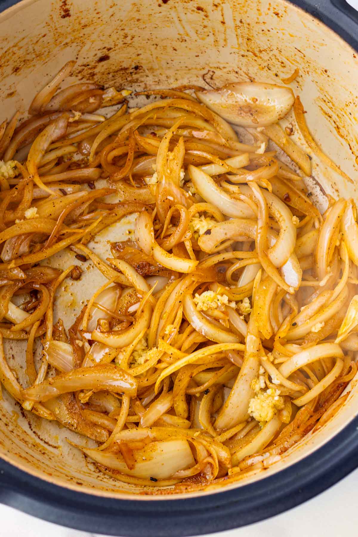 sauteing onions and garlic in a pot