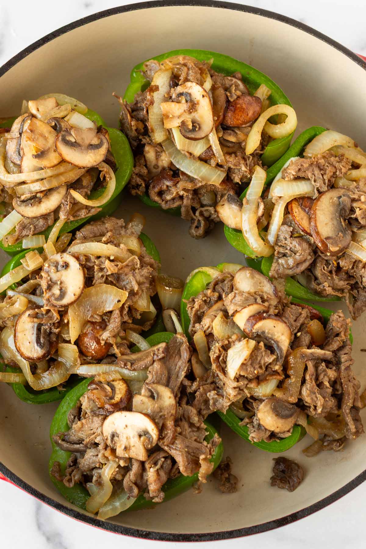 stuffed peppers with the filling in a pan