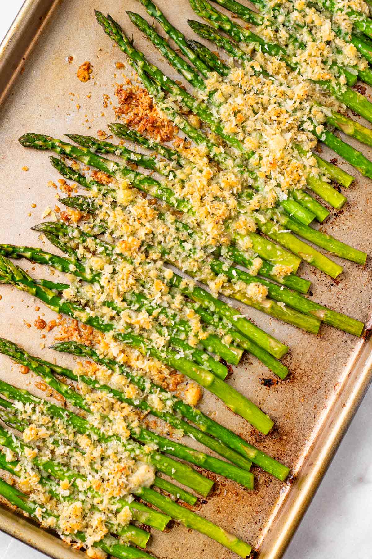 finished oven roasted asparagus with crunchy parmesan topping