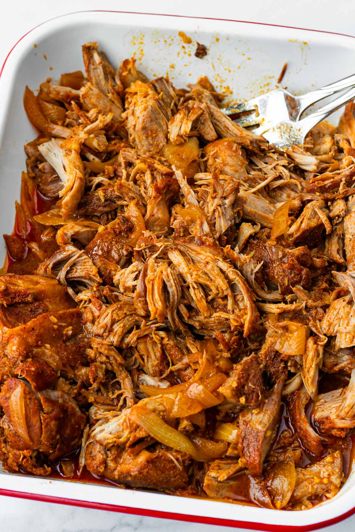 shredded slow cooker pulled pork in a pan