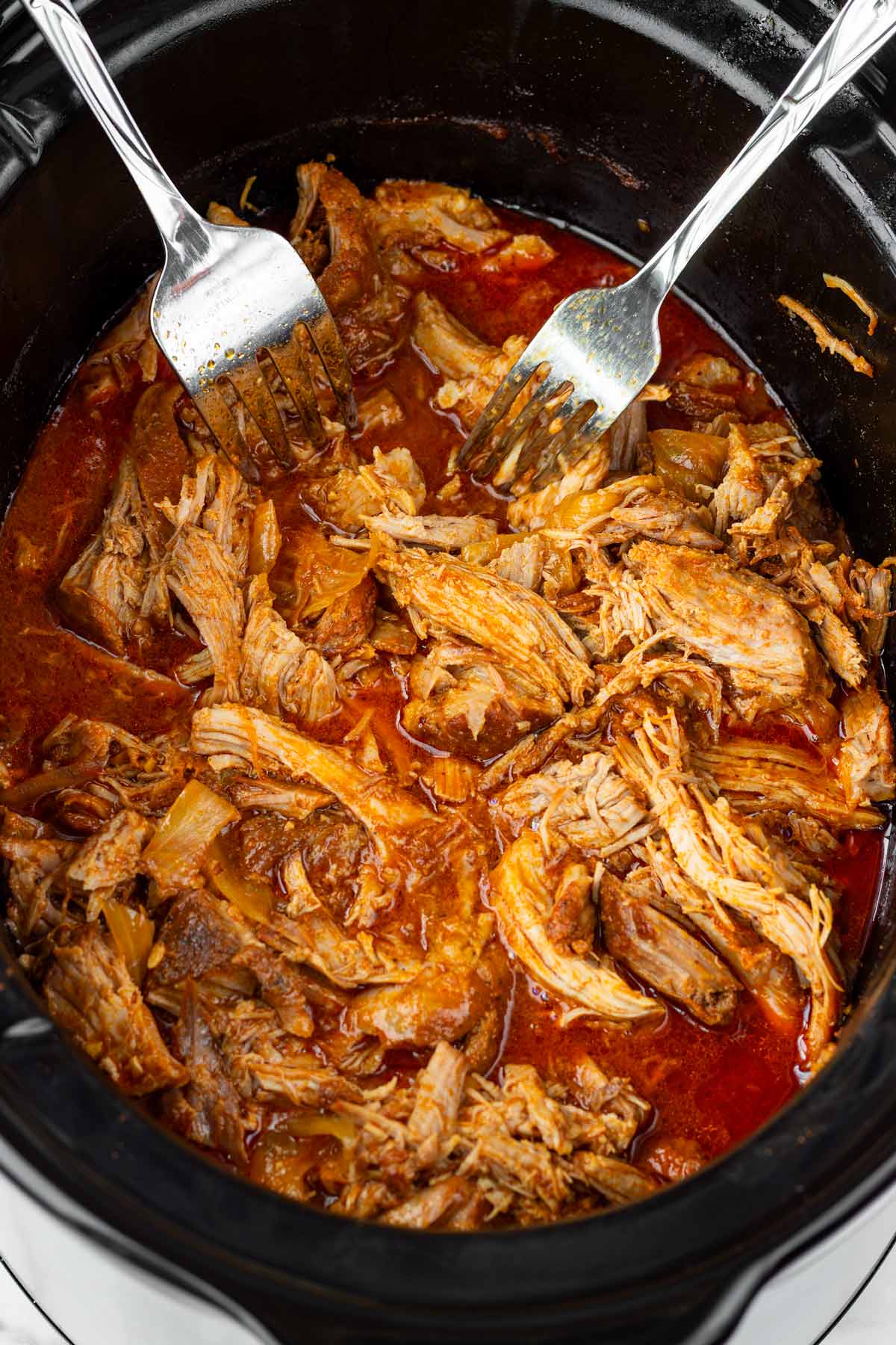 shredding pulled pork right in the crockpot