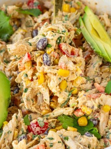 shredded creamy southwest chicken salad with avocado slices