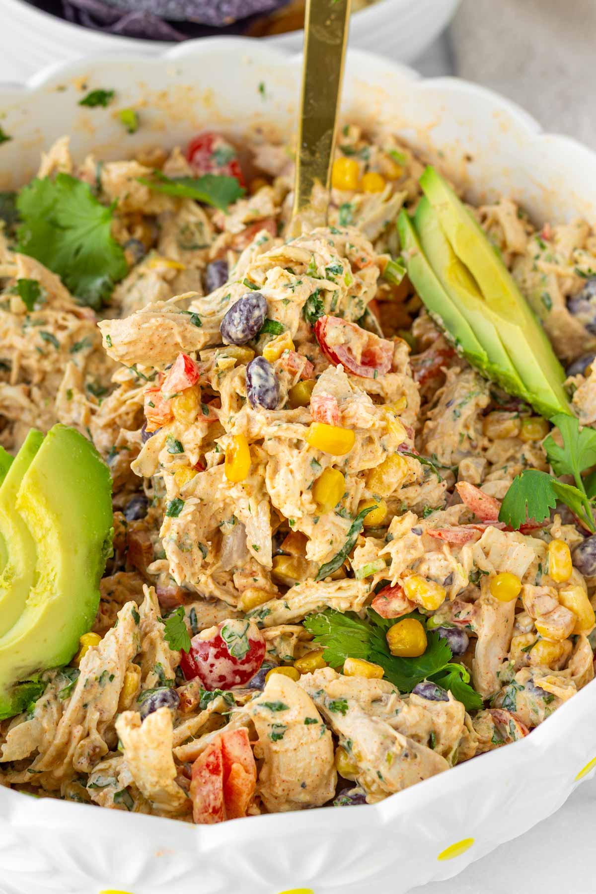 a spoonful of creamy southwest chicken salad with shredded chicken