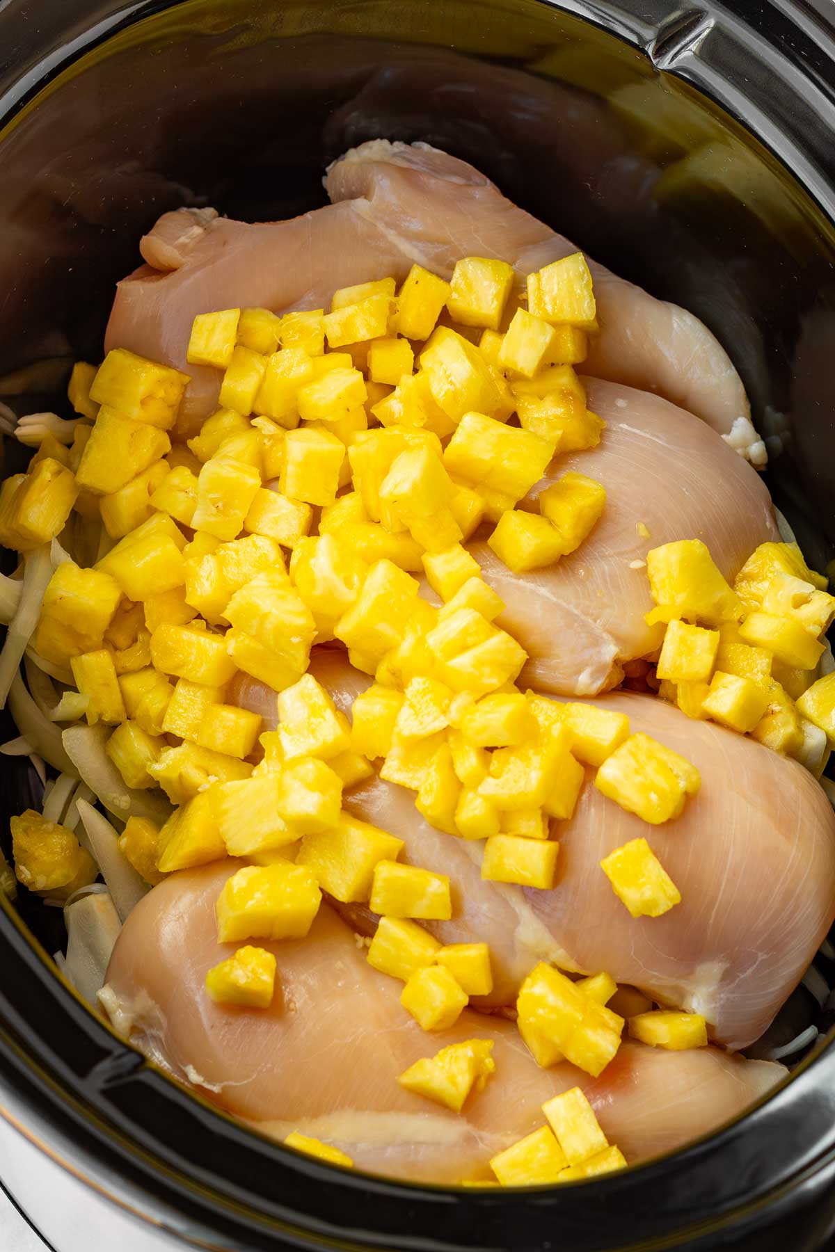 added pineapple cubes on top of chicken