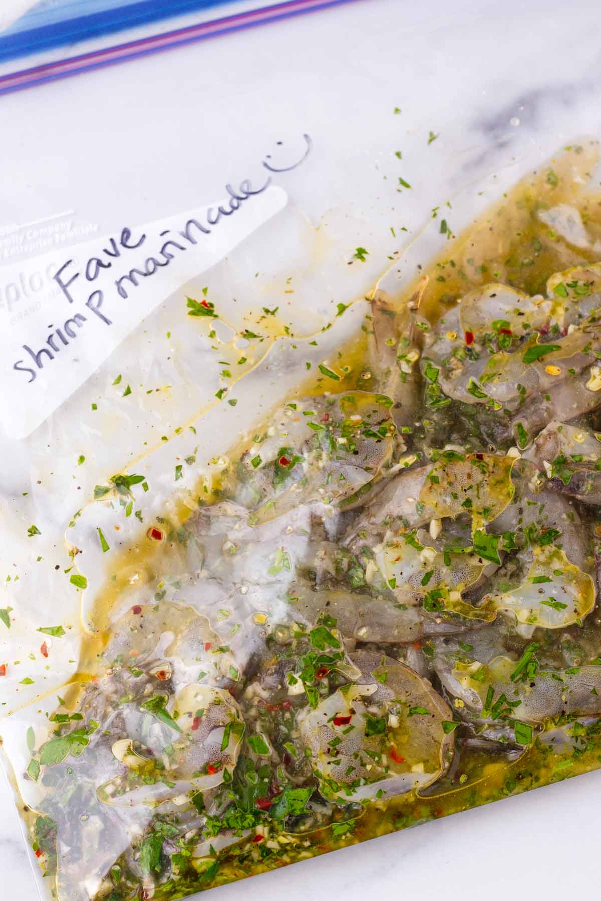 peeled shrimp inside a bag with the prepared marinade