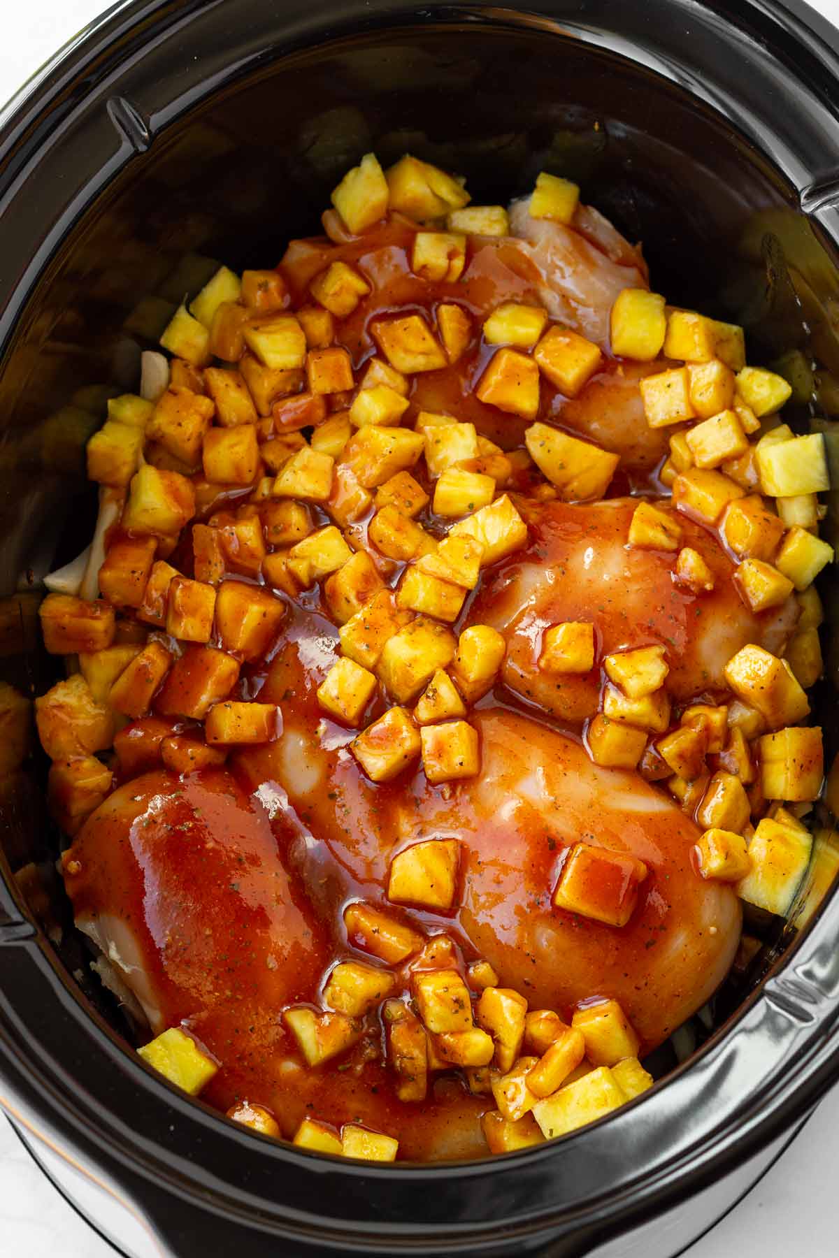 sauce added to the crockpot with the chicken