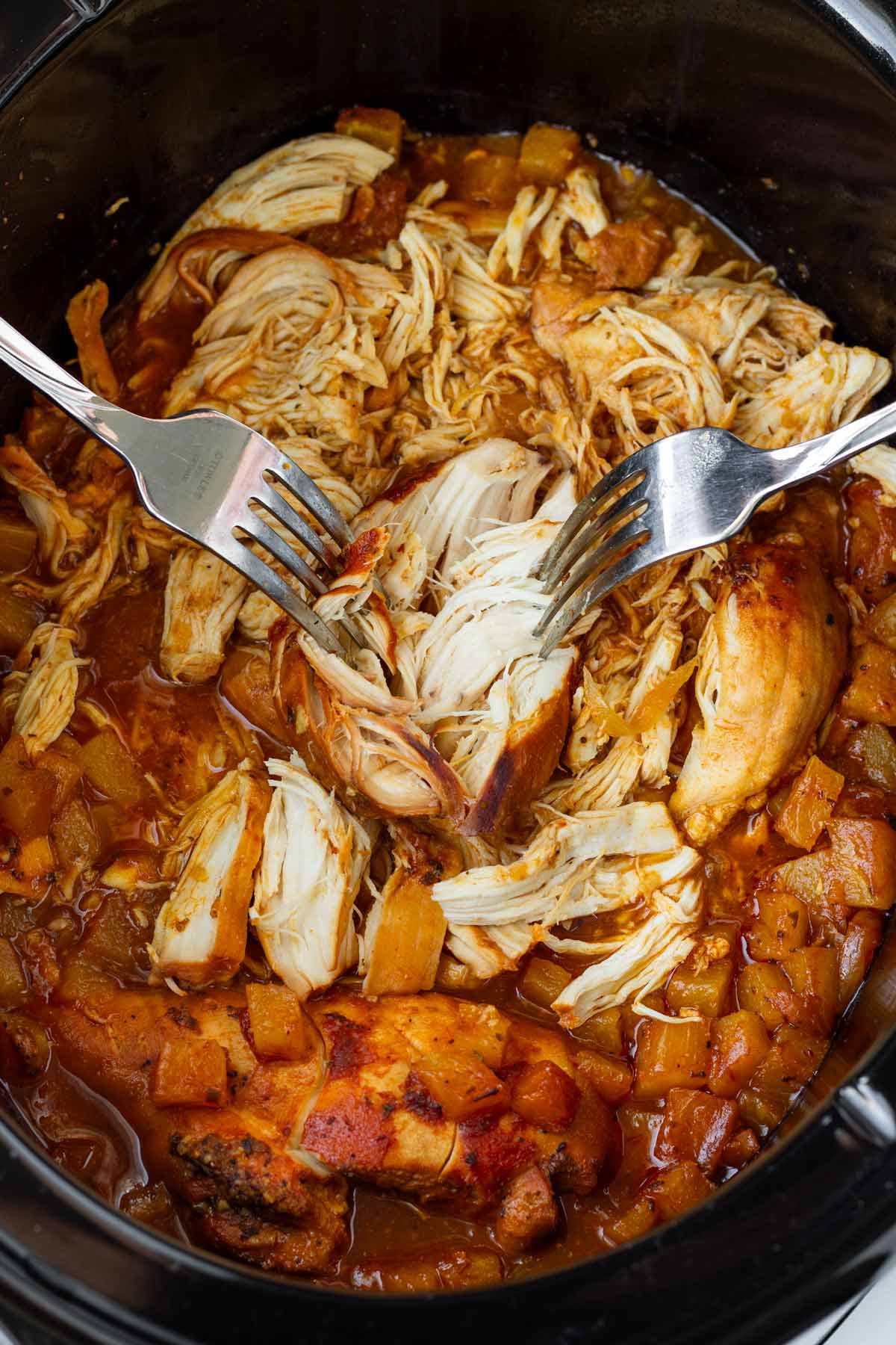 shredding pulled chicken right in the crockpot