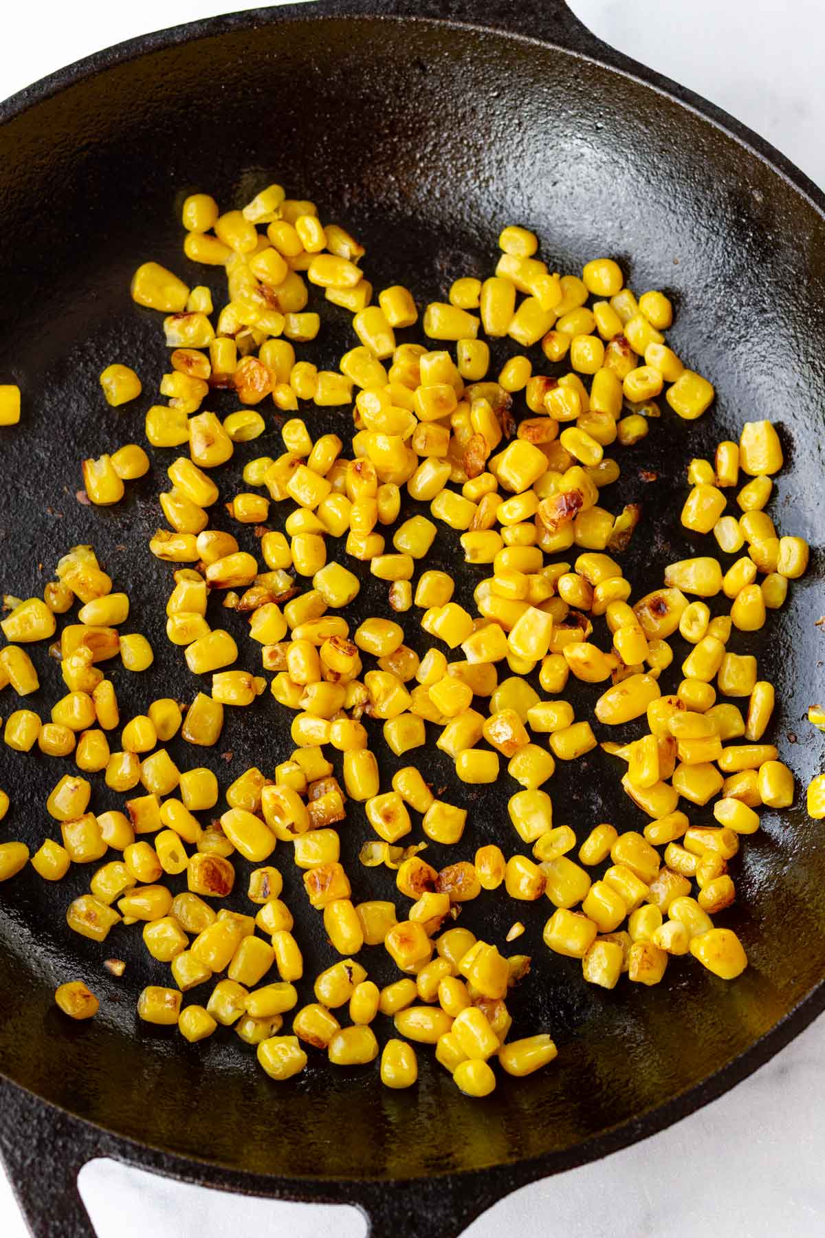 charred corn in cast iron skillet