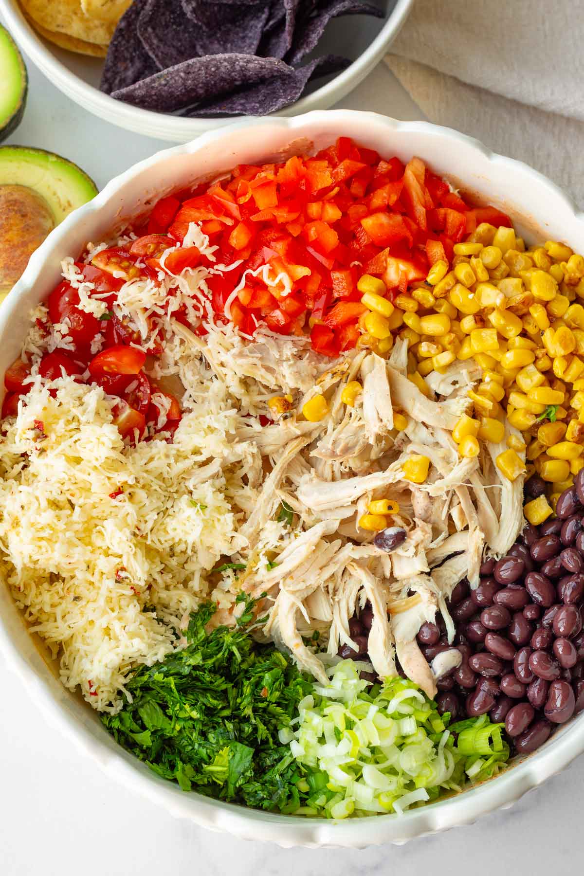 all the ingredients for the salad added in a large serving bowl