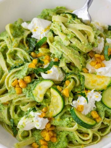 serving zucchini pasta with a fork