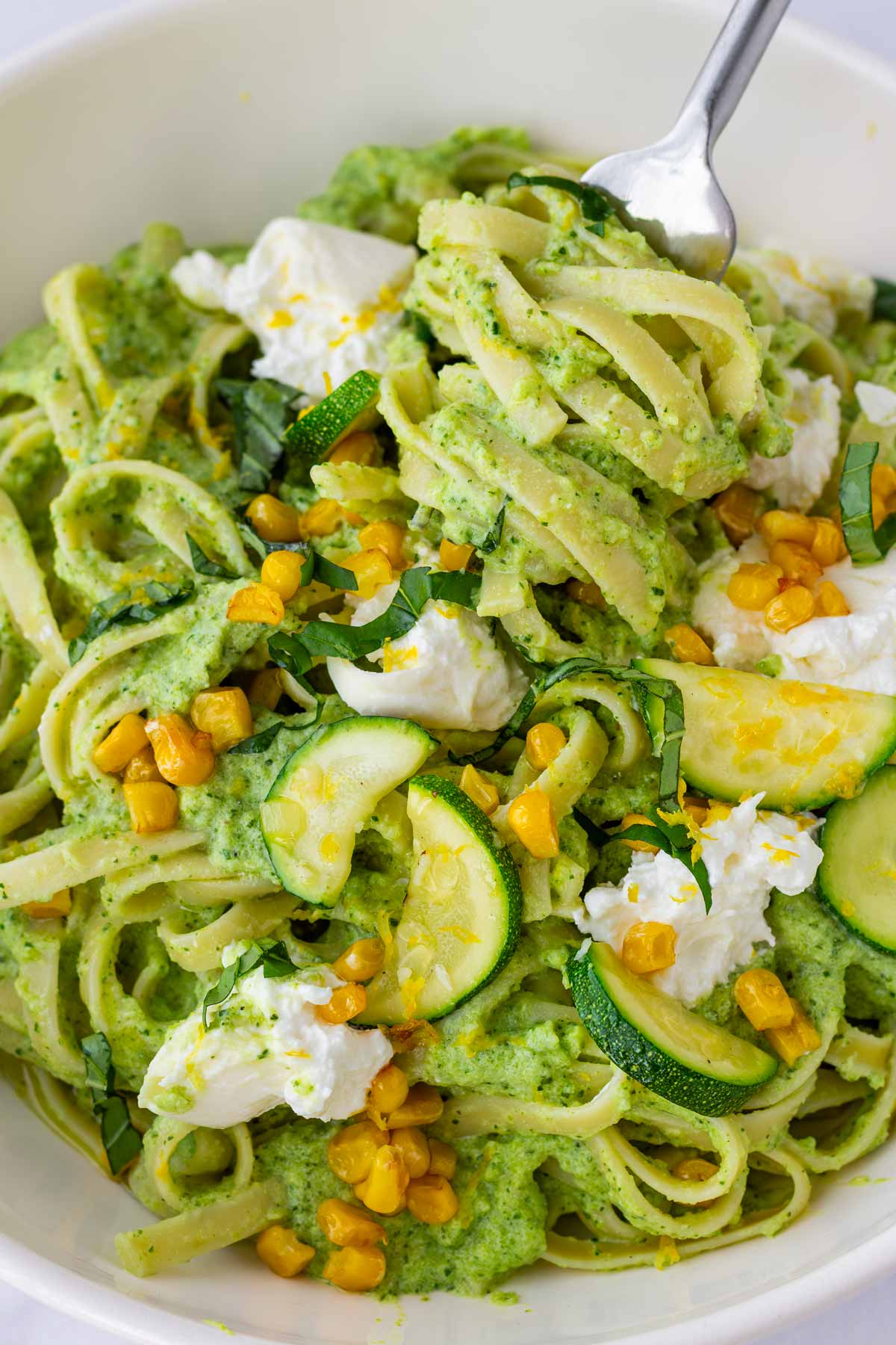 serving zucchini pasta with a fork