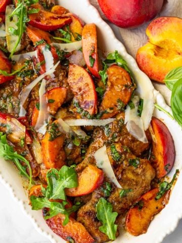 balsamic peaches with chicken served in a long plate