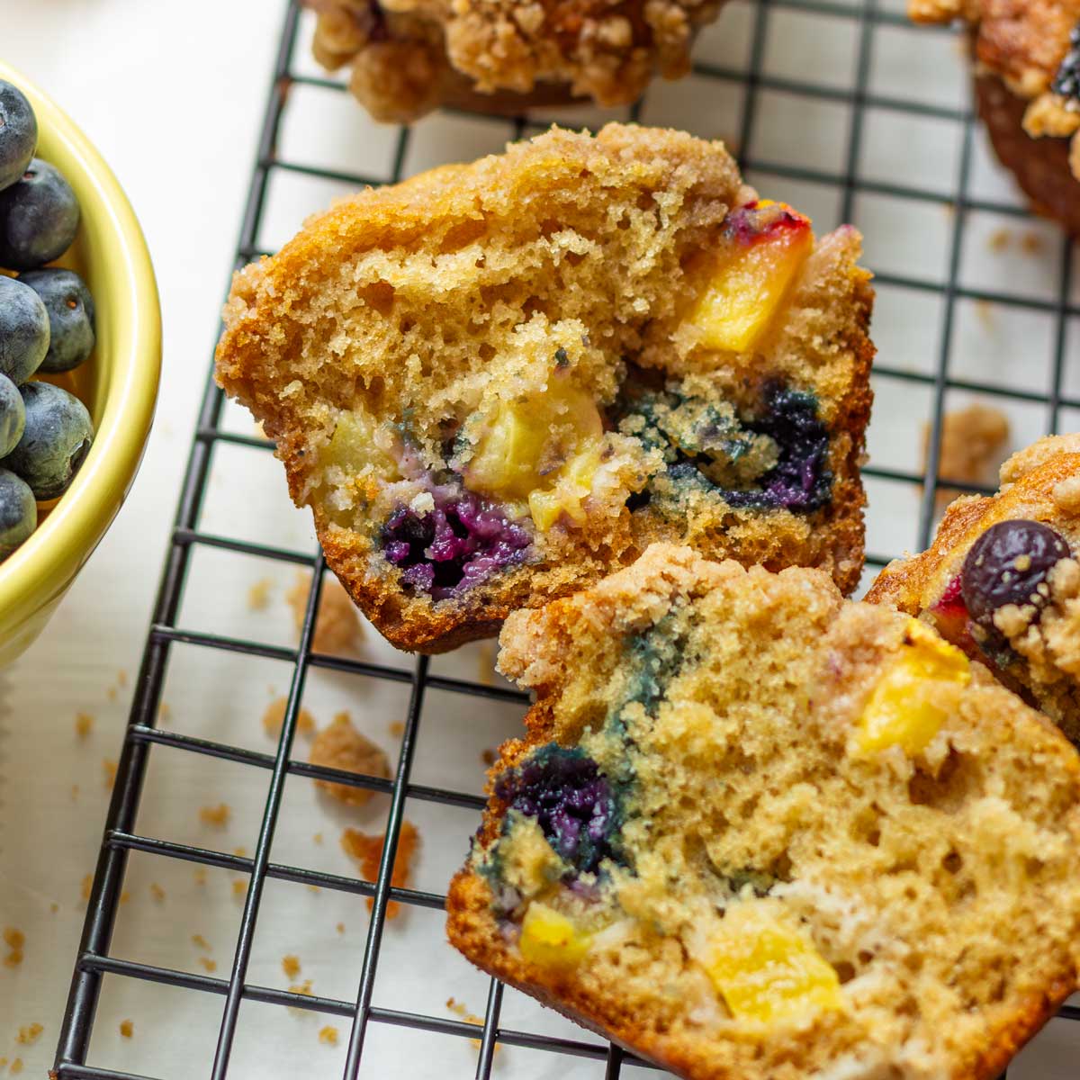 inside of a blueberry peach muffin bakery style