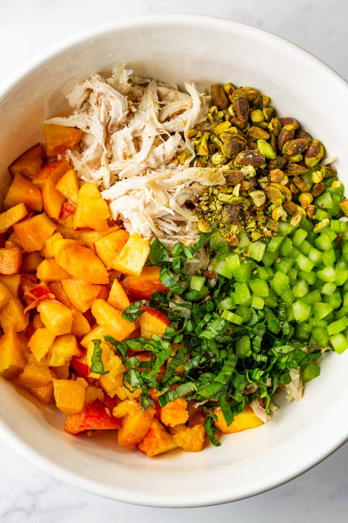 bowl with ingredients for chicken salad arranged