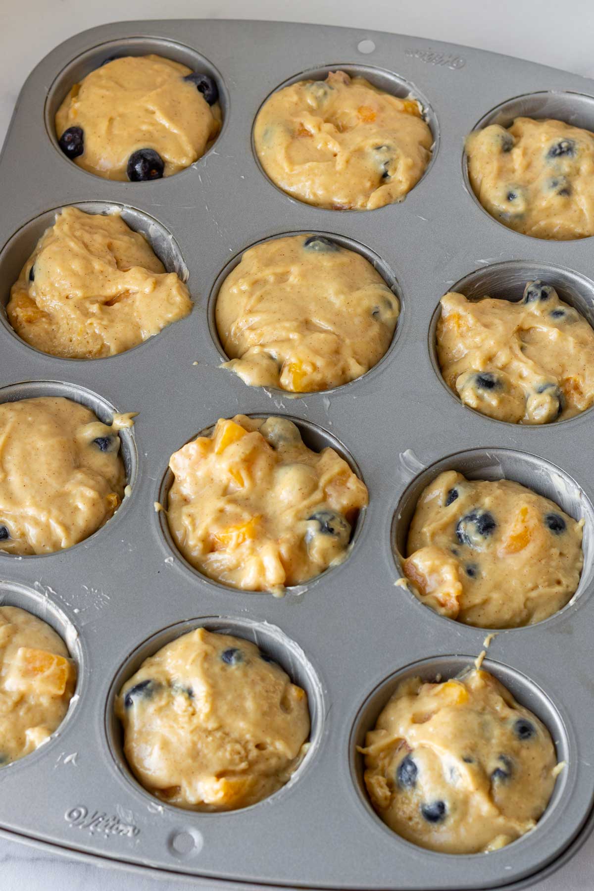 batter added into the muffin pan