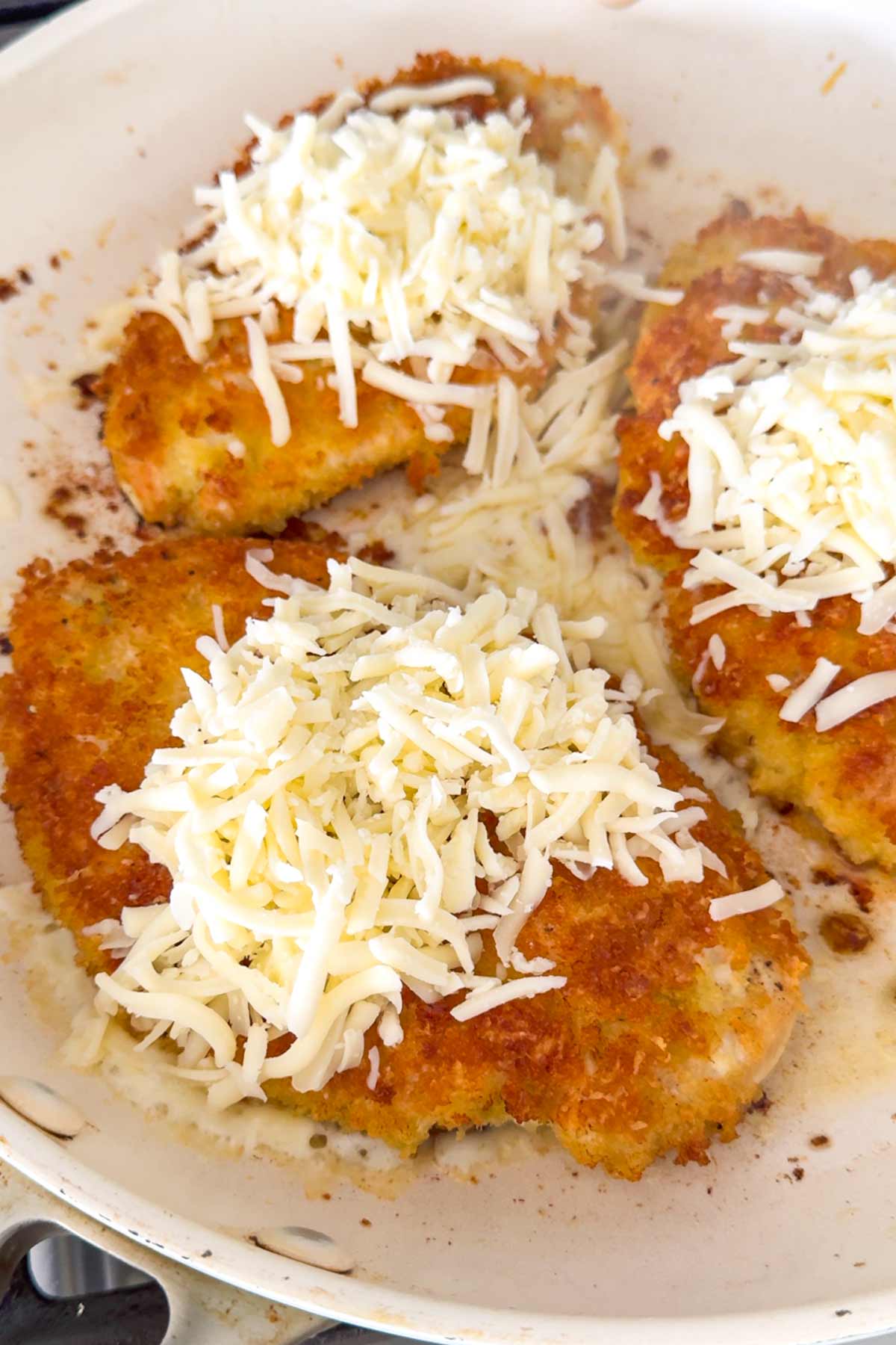 cheese added on top of chicken cutlets
