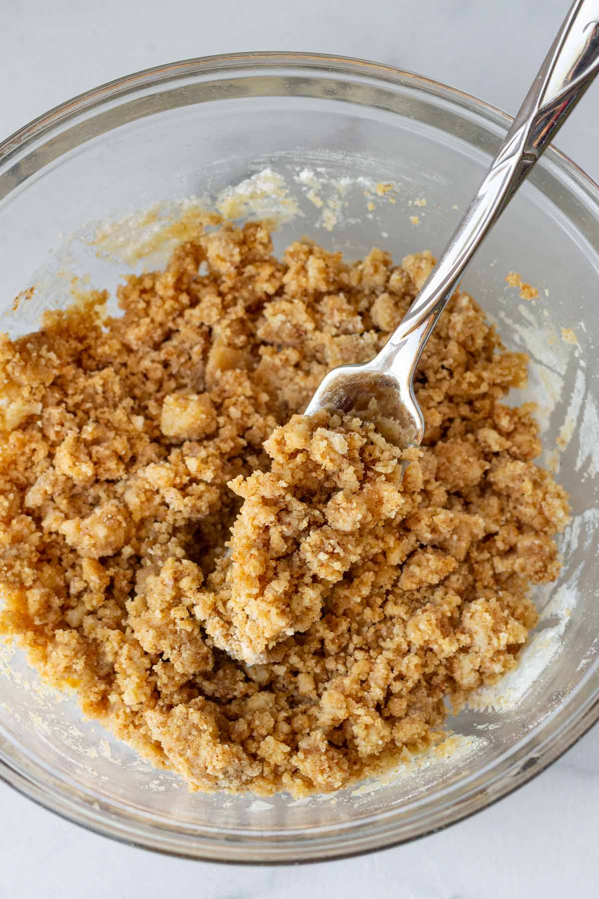 mixing the streusel topping in a bowl