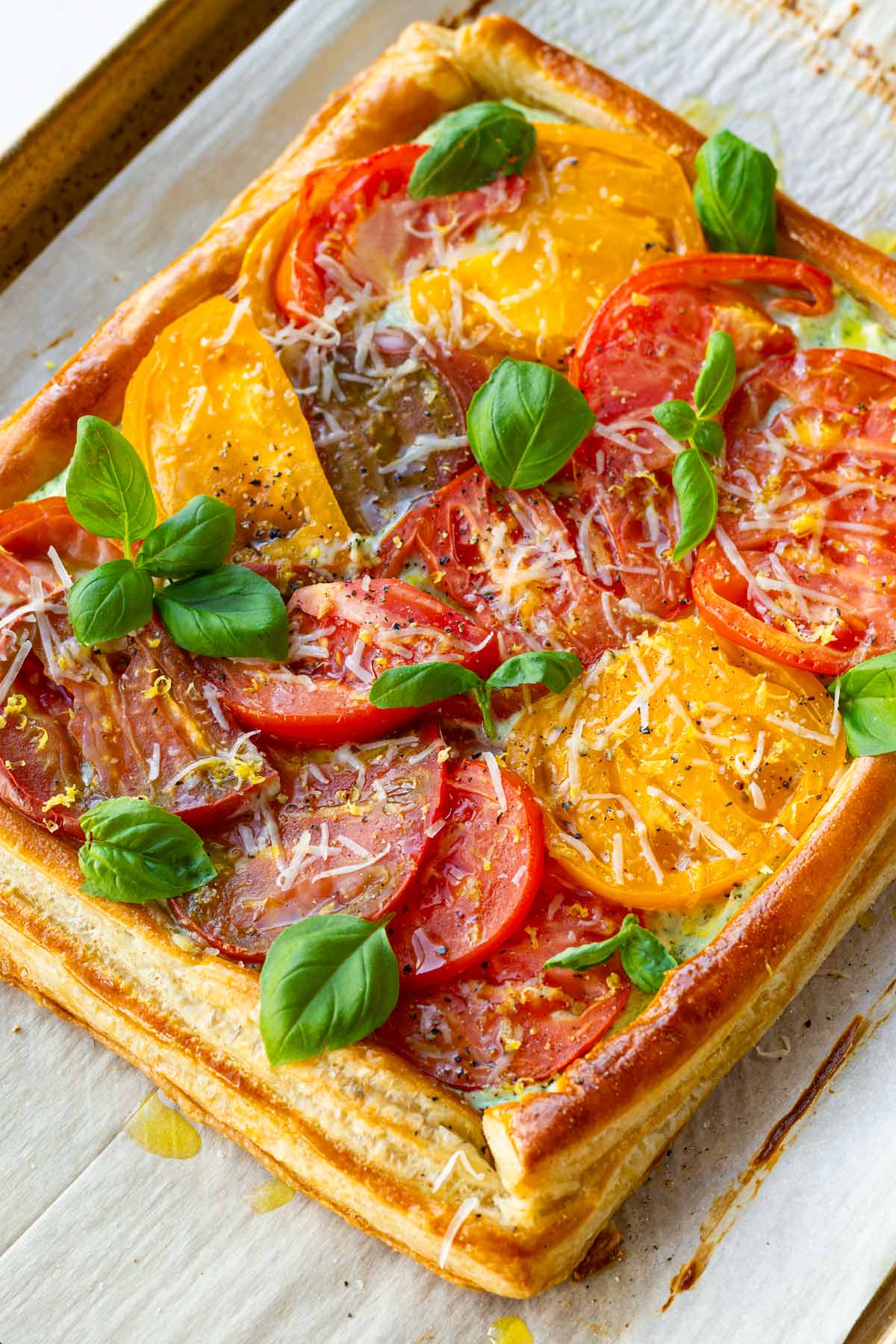 beautiful tomato tart over whipped basil ricotta and puff pastry