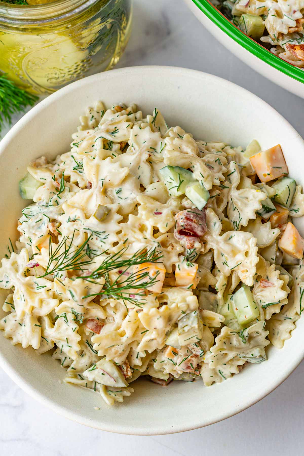 dill pickle pasta salad in individual bowl