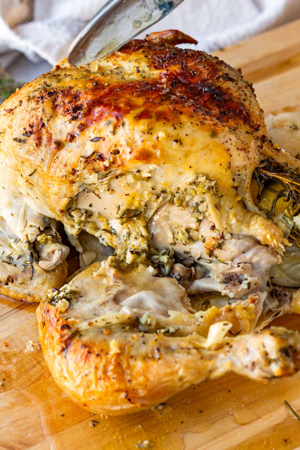 cut up inside the roast chicken to show juices flowing