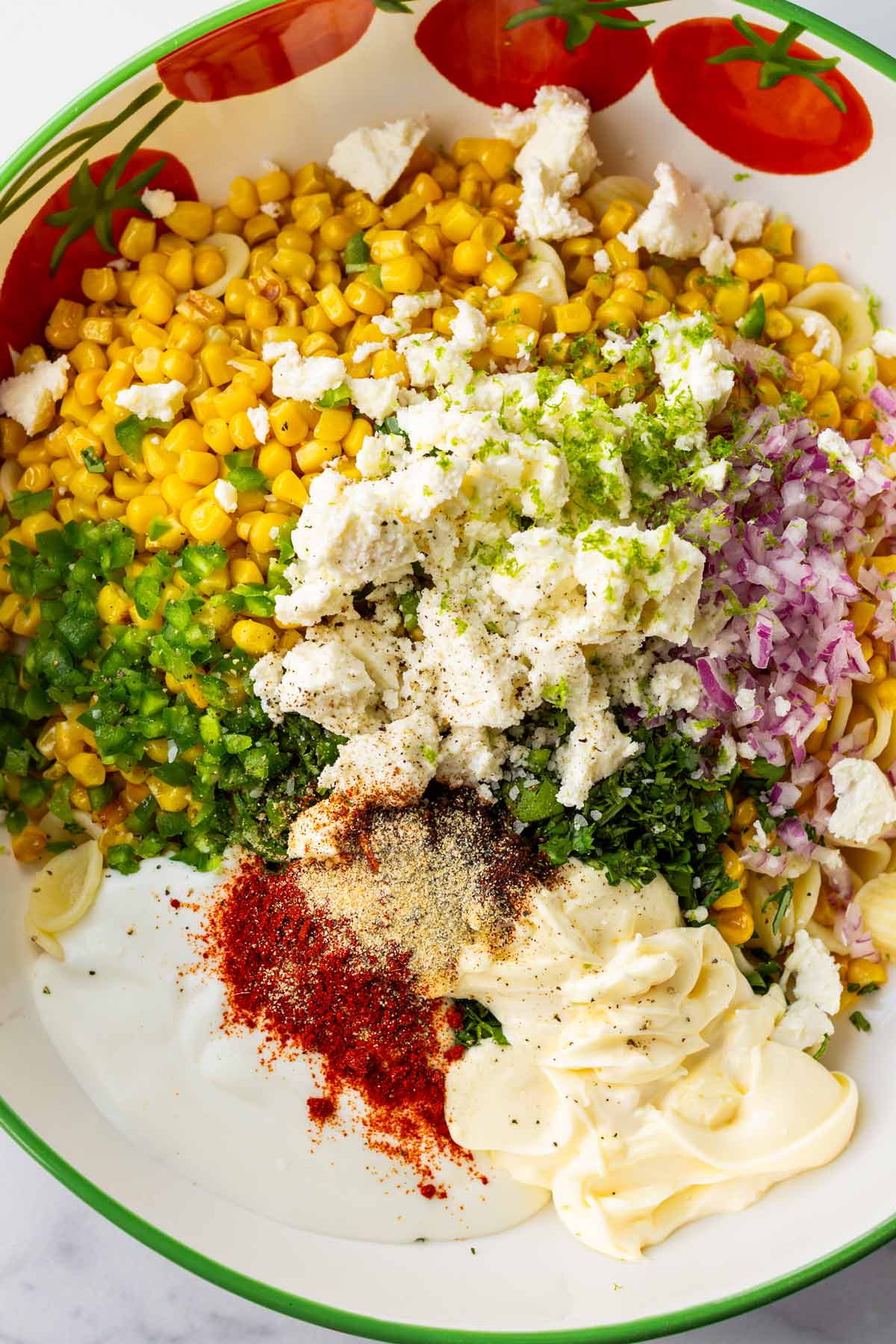 ingredients all combined in bowl to make the pasta salad