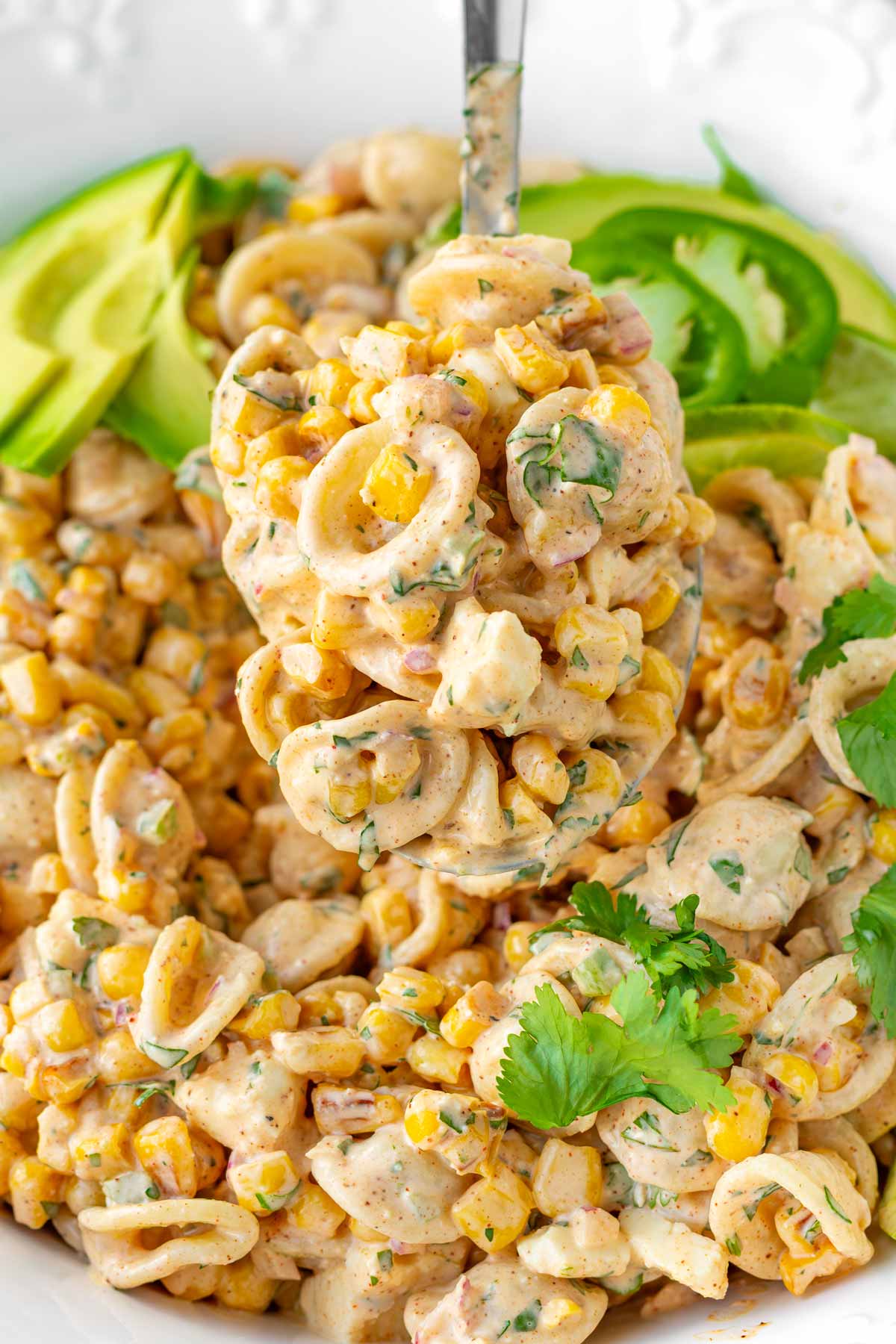 a spoonful serving of mexican street corn pasta salad
