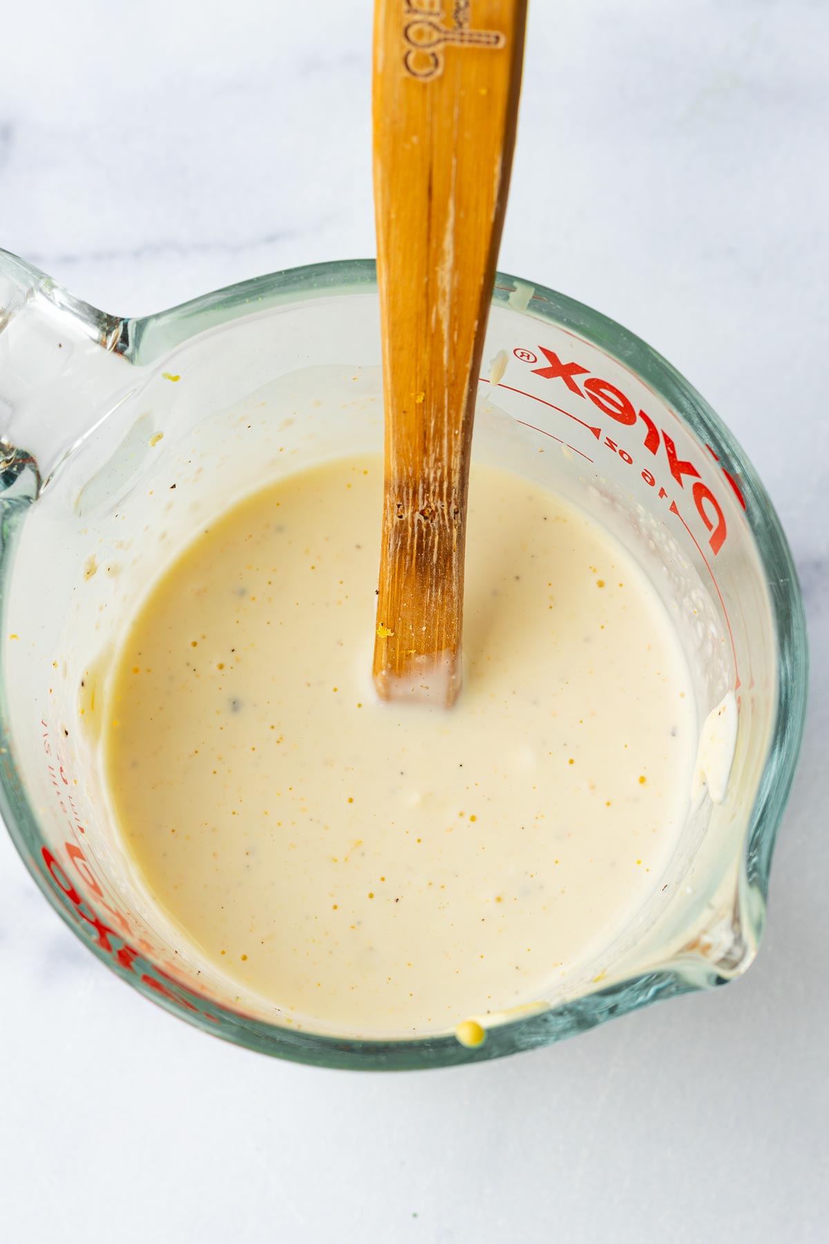 whisking the creamy dressing