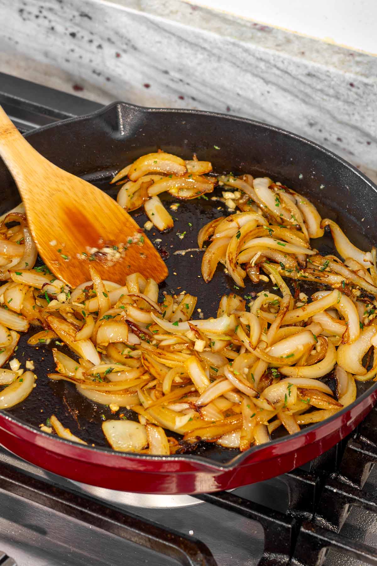 cooking onions, garlic, herbs in the pan