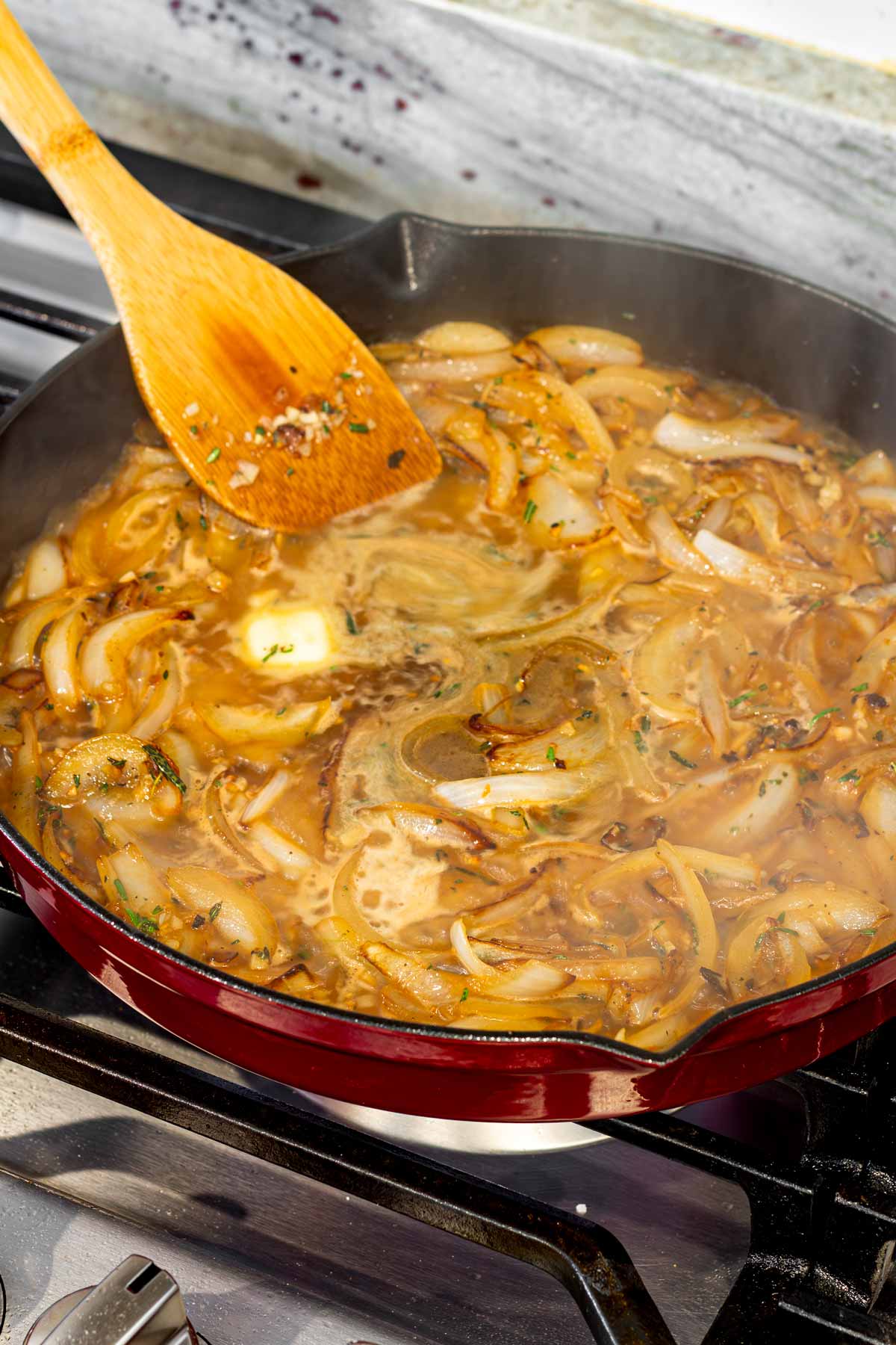 added apple cider and liquids to the pan