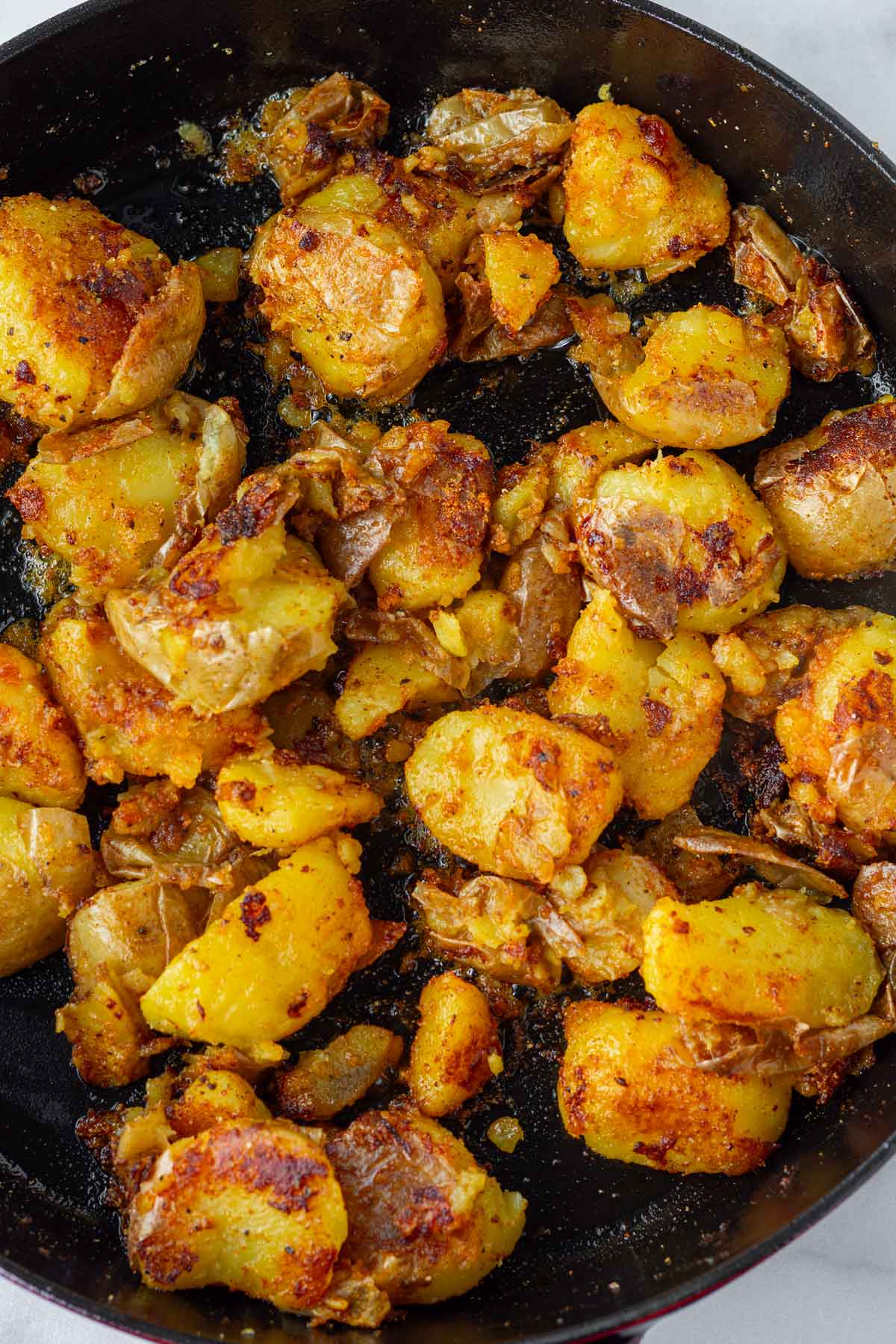 golden seared potatoes in a pan