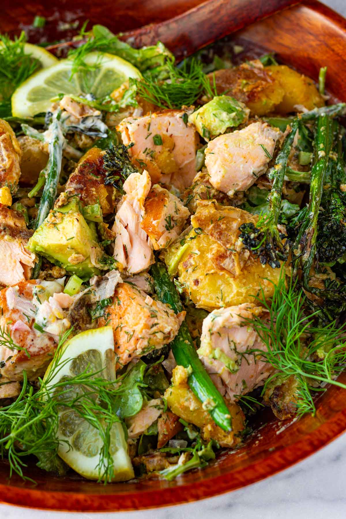 salmon and potato salad in bowl mixed