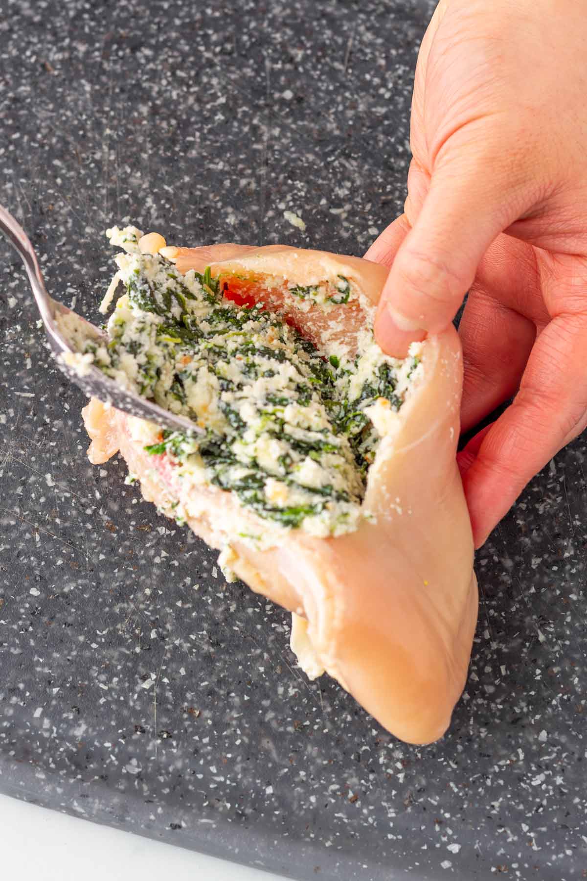 filling with chicken breast with the mixture