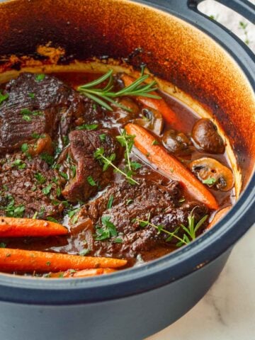 braised beef in dutch oven cooked with red wine
